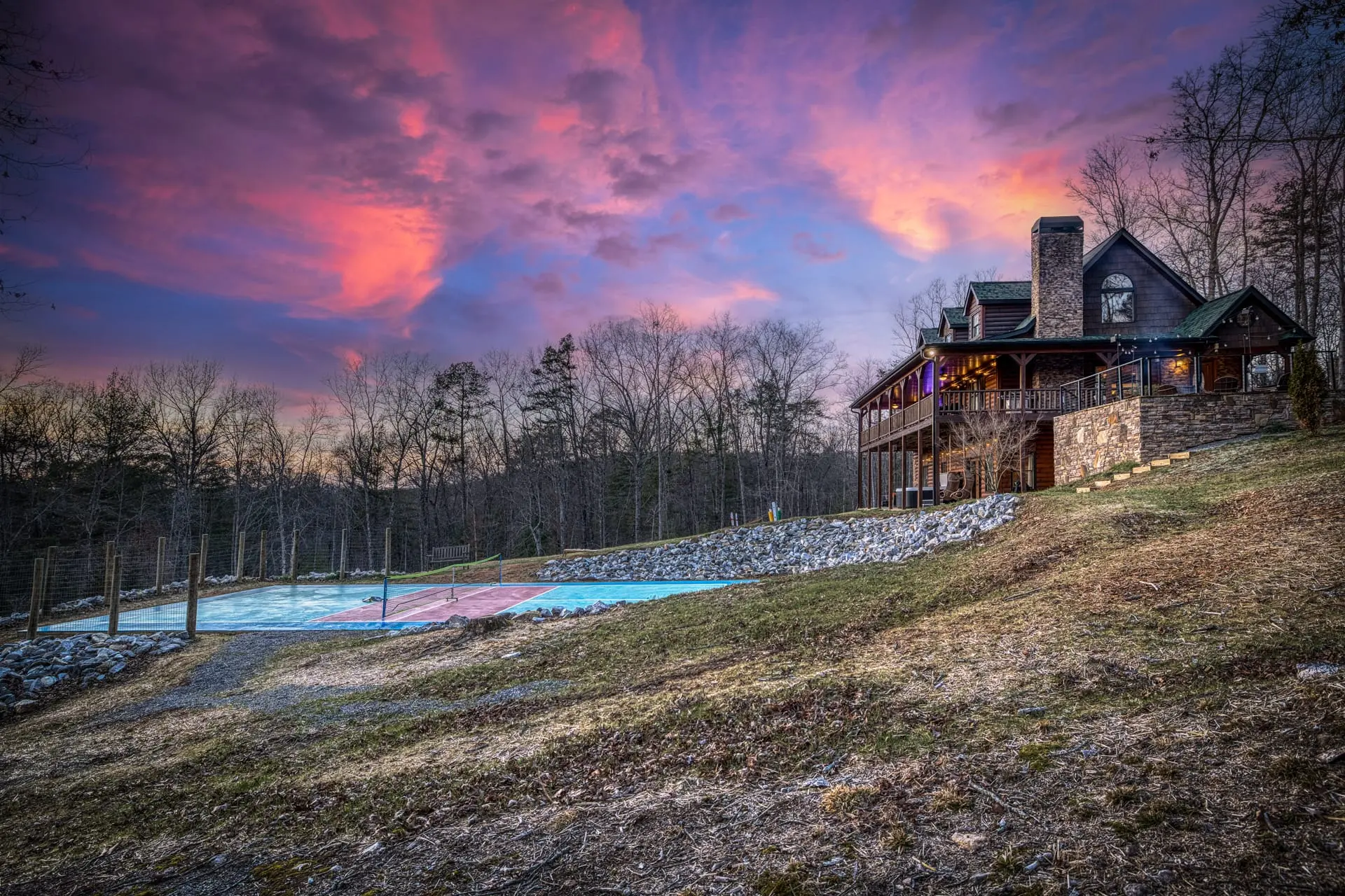Rustic lodge with sport court, broad decks & sunset views